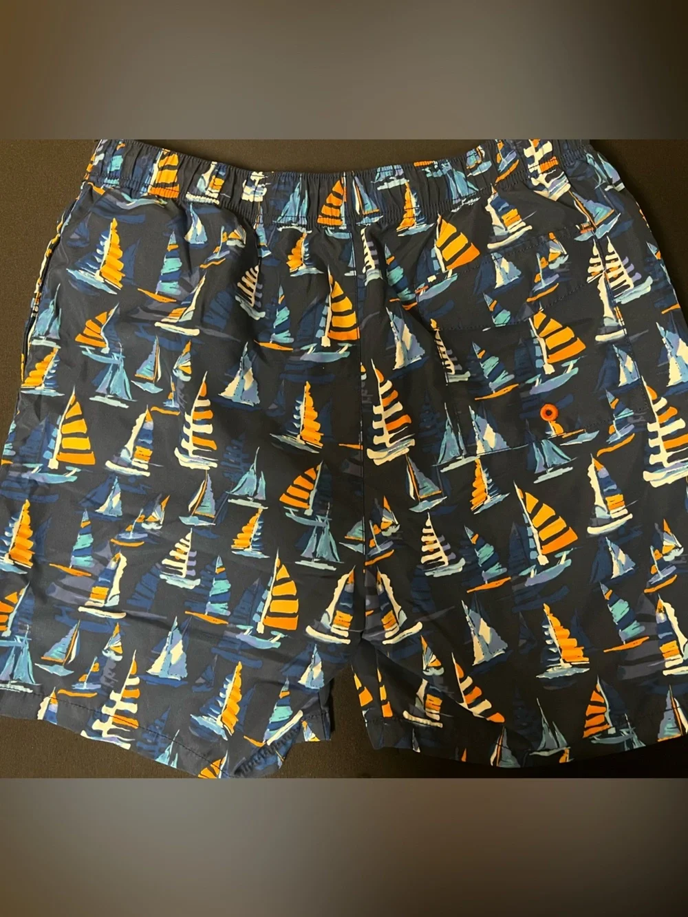 TOMMY BAHAMA RELAX NAVY TRUNKS W/ORANGE/LT BLUE SAILBOAT PRINT. MEDIUM